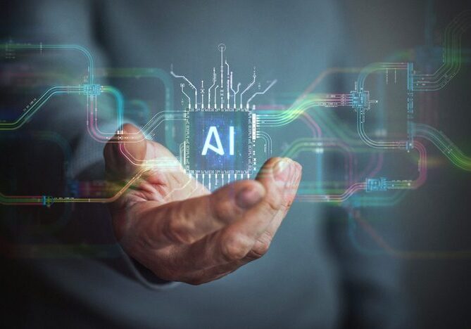 Hand holding a microchip labeled "AI".